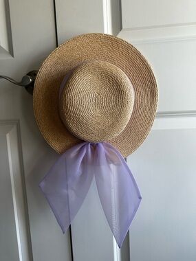 Eugenia Kim Hat with a lavender bow